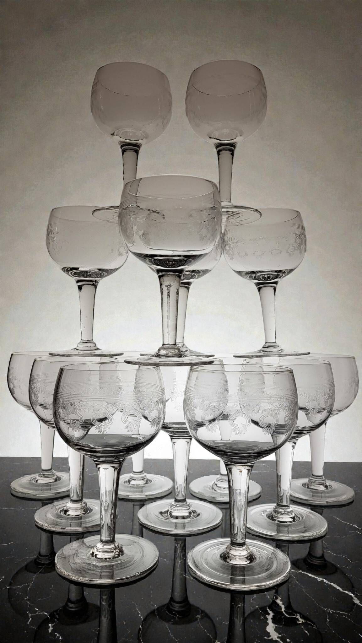 9 guilloché wine glasses, early 20th century.