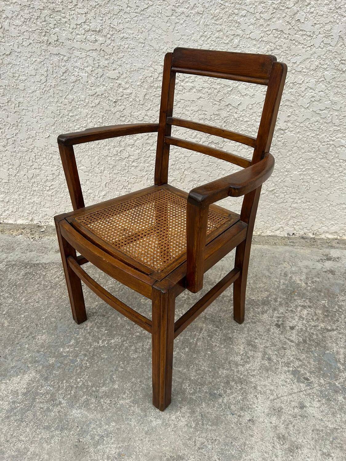 Cane armchair with armrests