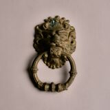 Lion door knocker, in brass