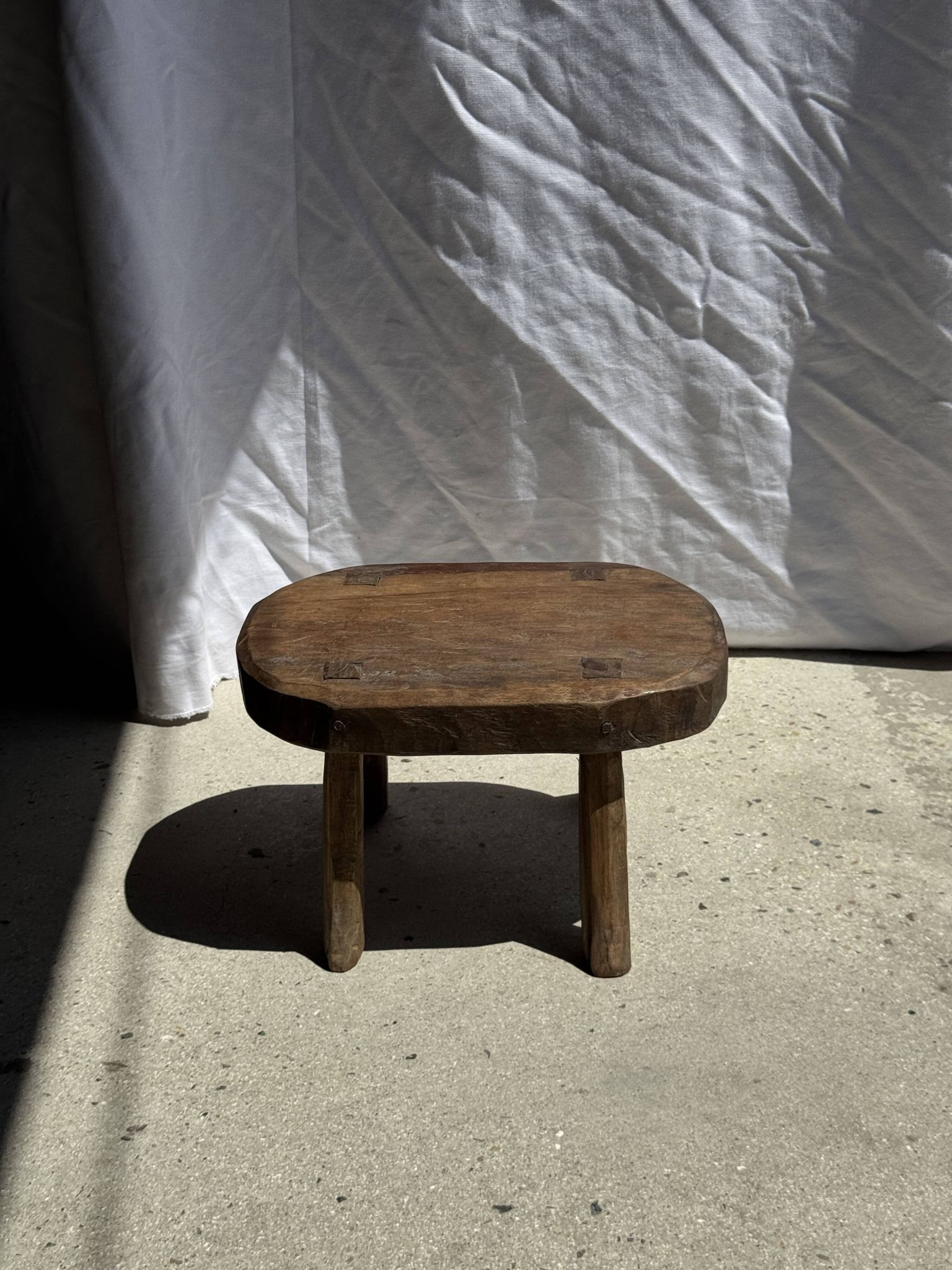 Small stool, oval solid teak accent stool with a two-tone seat.