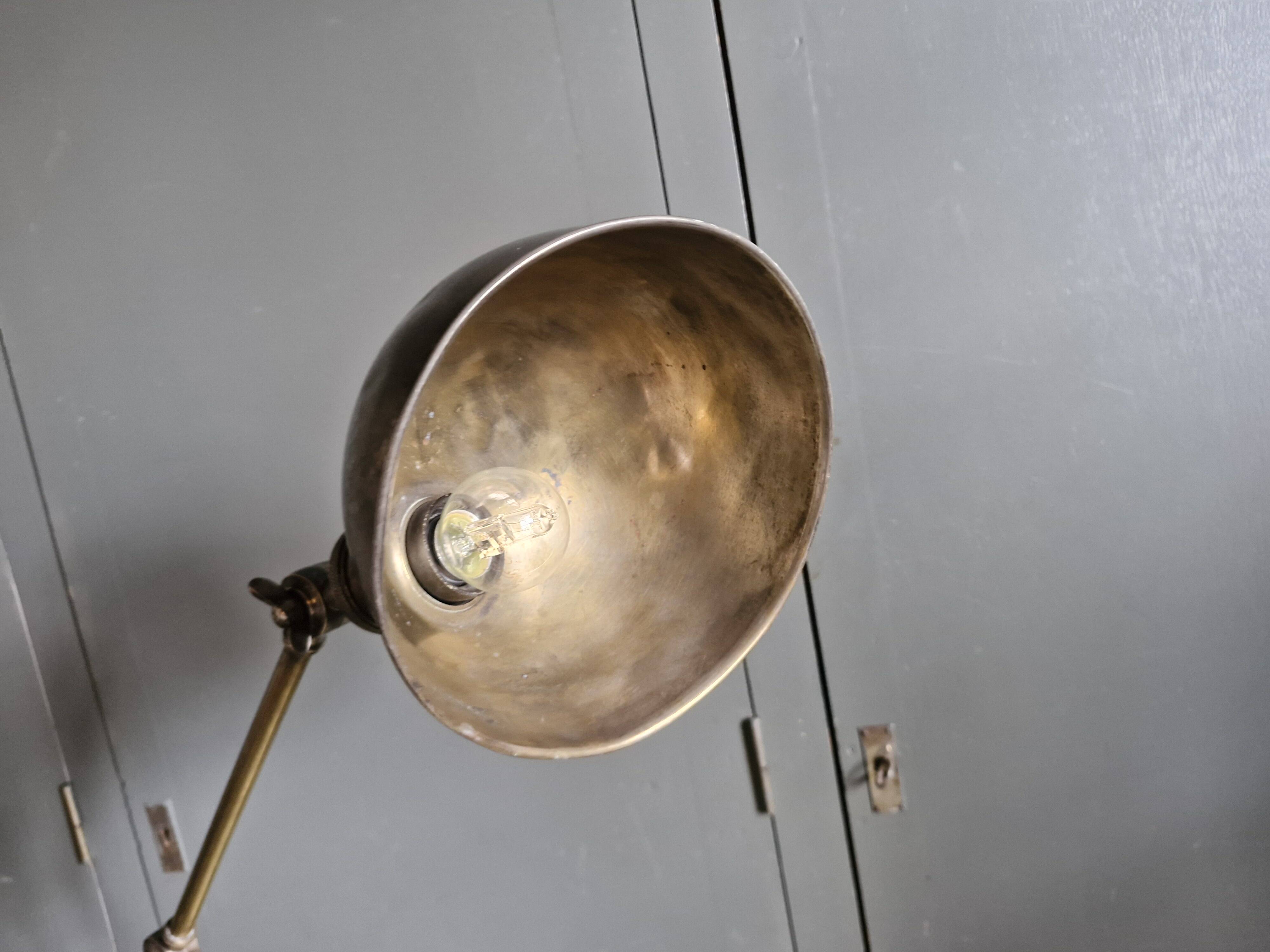 Old adjustable industrial lamp in bronze with 2 arms.