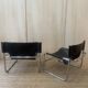 Black leather armchairs with a metal frame by Rodney Kinsman.