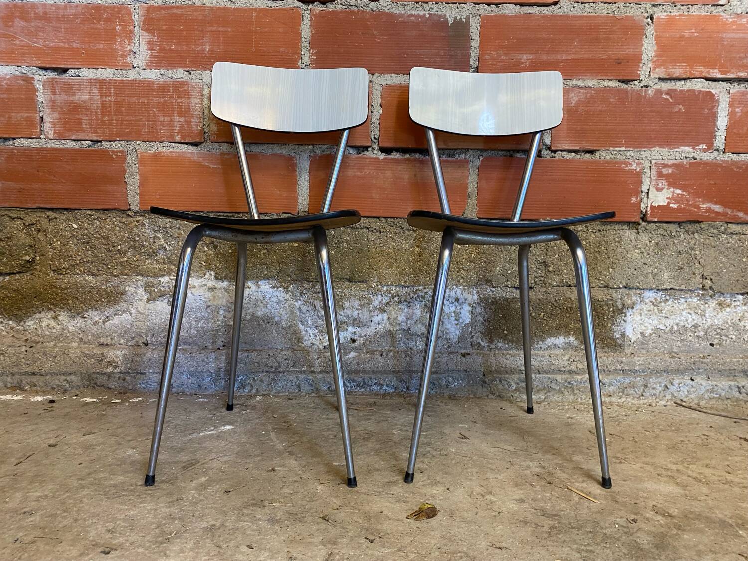 Pair of antique chrome metal chairs + white formica seat & back