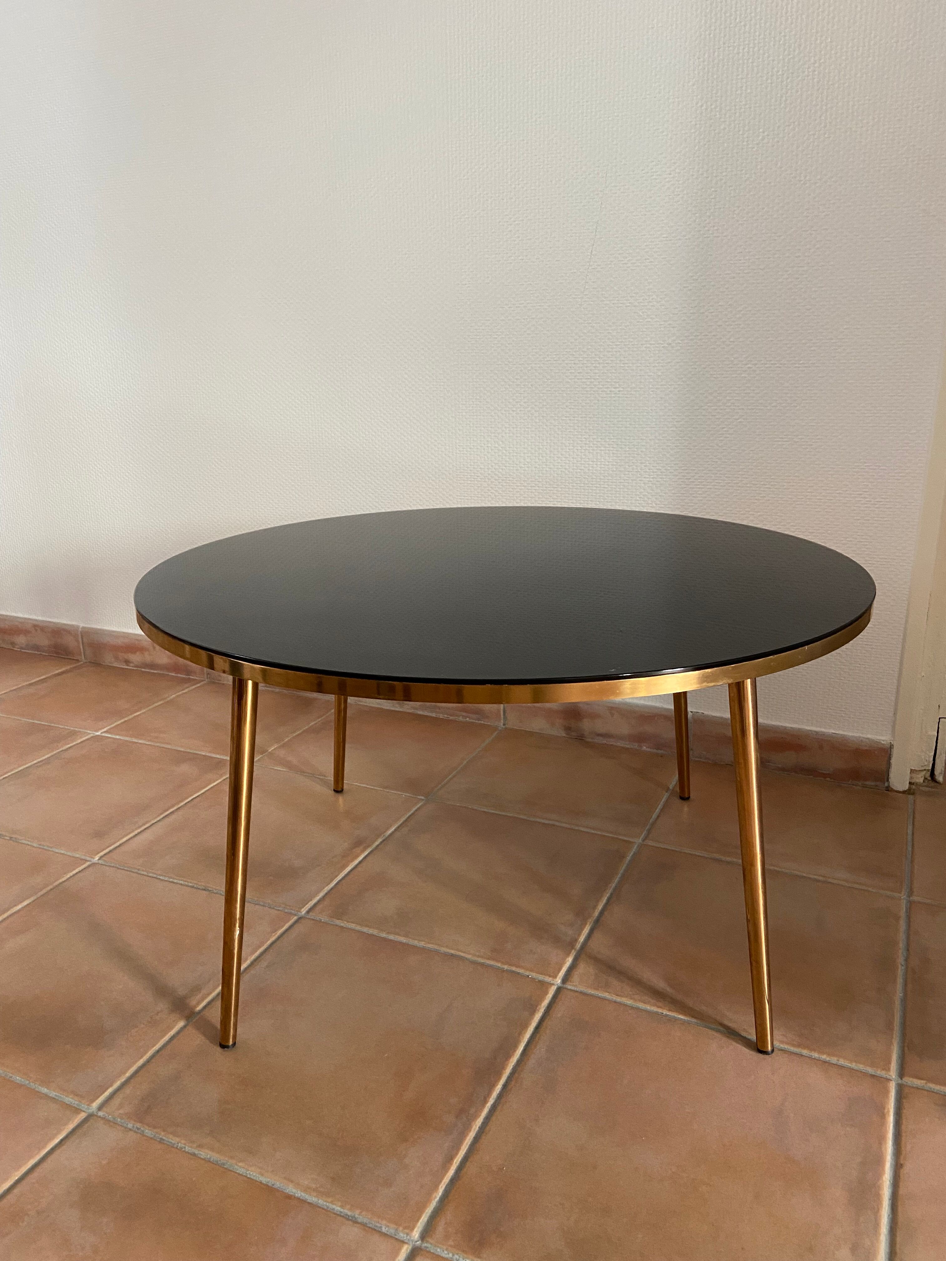 Coffee table black glass top and golden compass legs