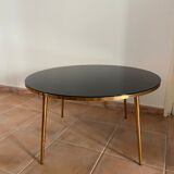 Table basse plateau verre noir et pieds compas dorés