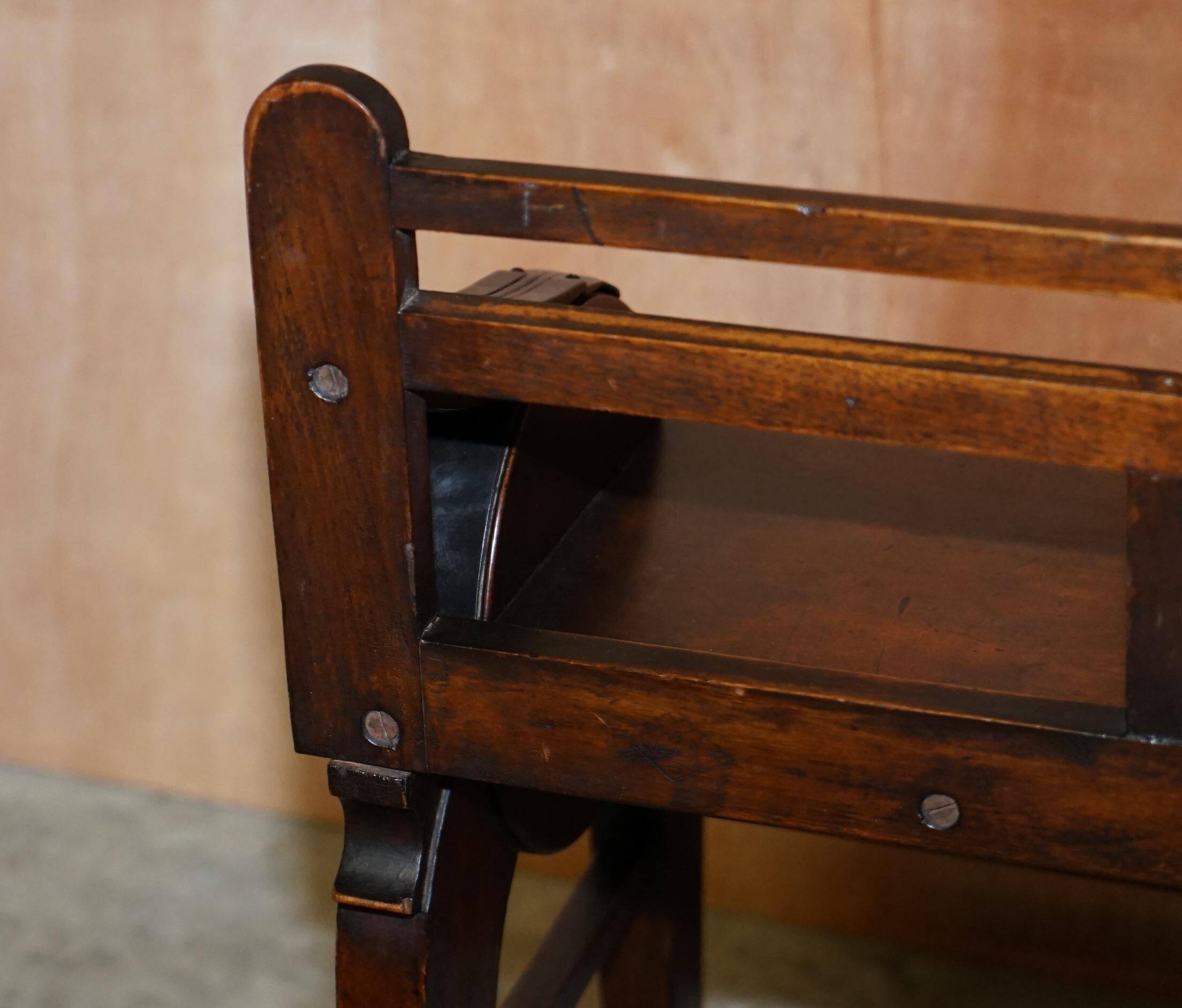 Antique entrance bench by Jas Shoolbred with brass fittings and walnut frame circa 1890.