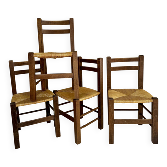 Set of four straw-seated farmhouse chairs.