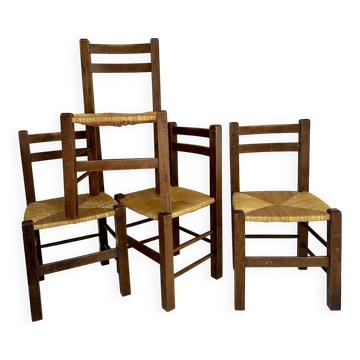 Set of four straw-seated farmhouse chairs.