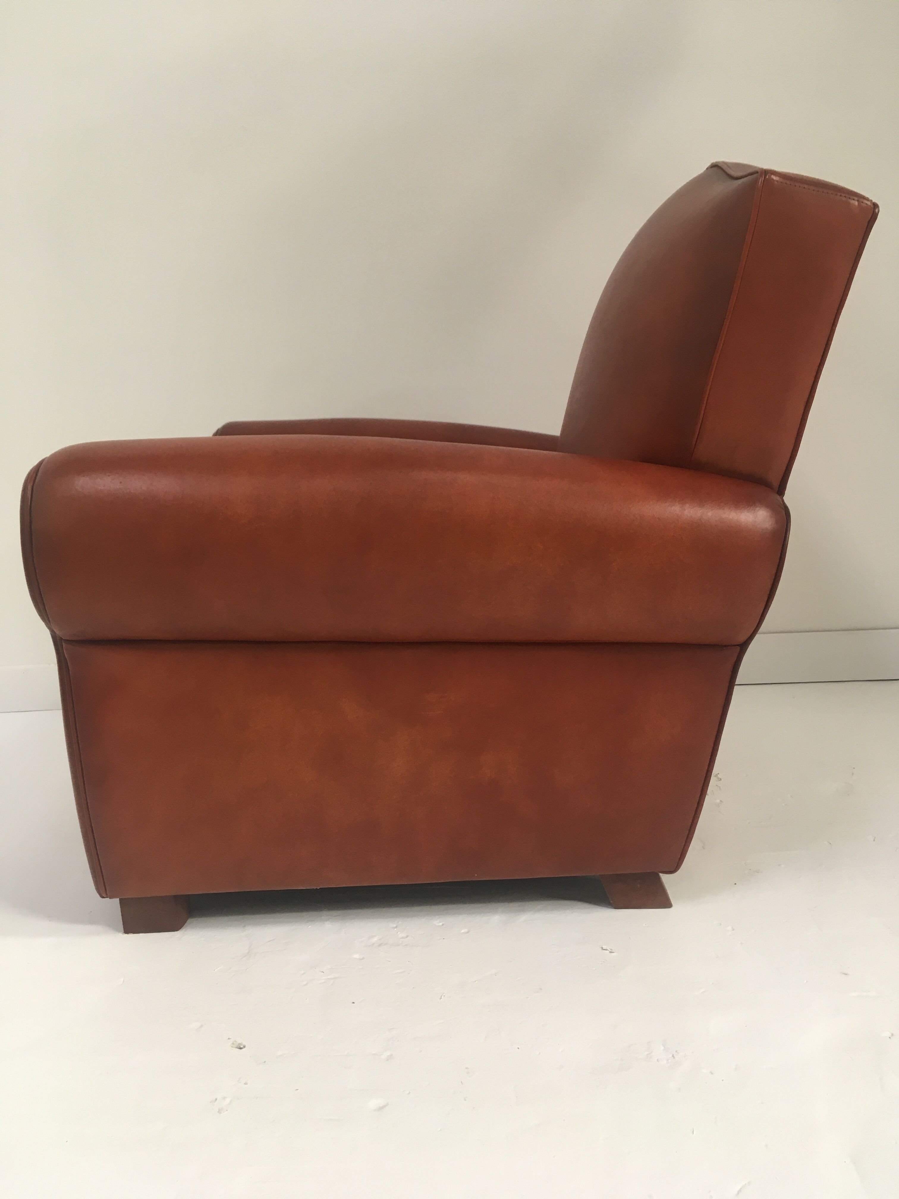 Large club chair in cognac leather