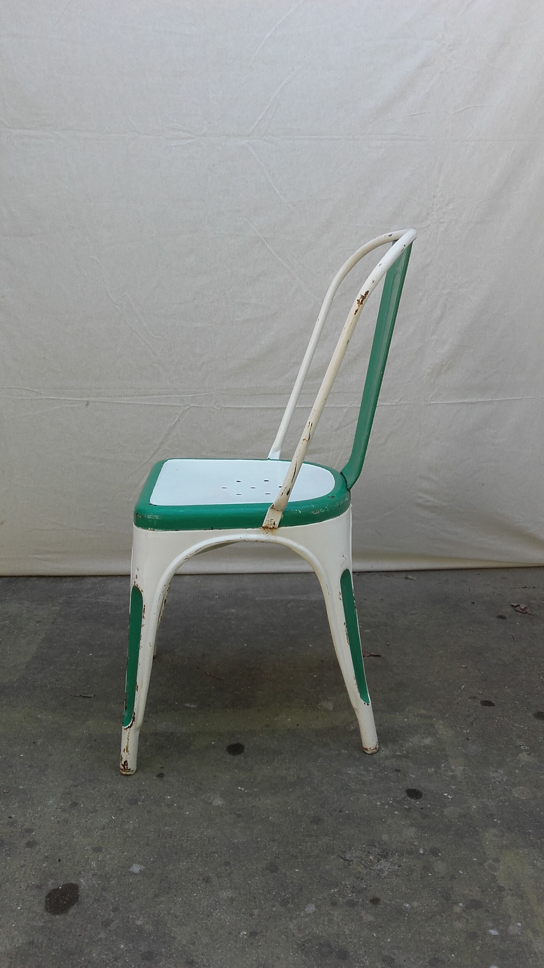 Four old Tolix Model A chairs