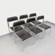 Set of 6 vintage Italian stackable chairs in chrome metal and faux leather.
