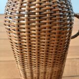 Bottle, old carafe in glass and wicker, 1950s