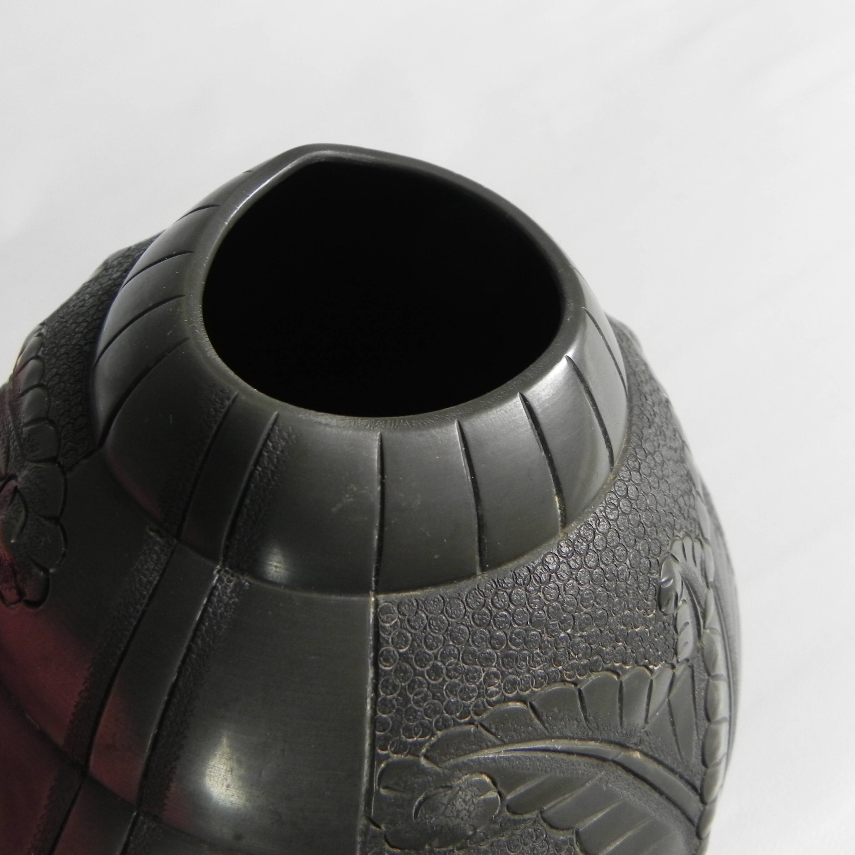 Art Nouveau pewter vase, signed PETIZON, early 20th century.