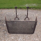 Shield fire with cast iron andirons