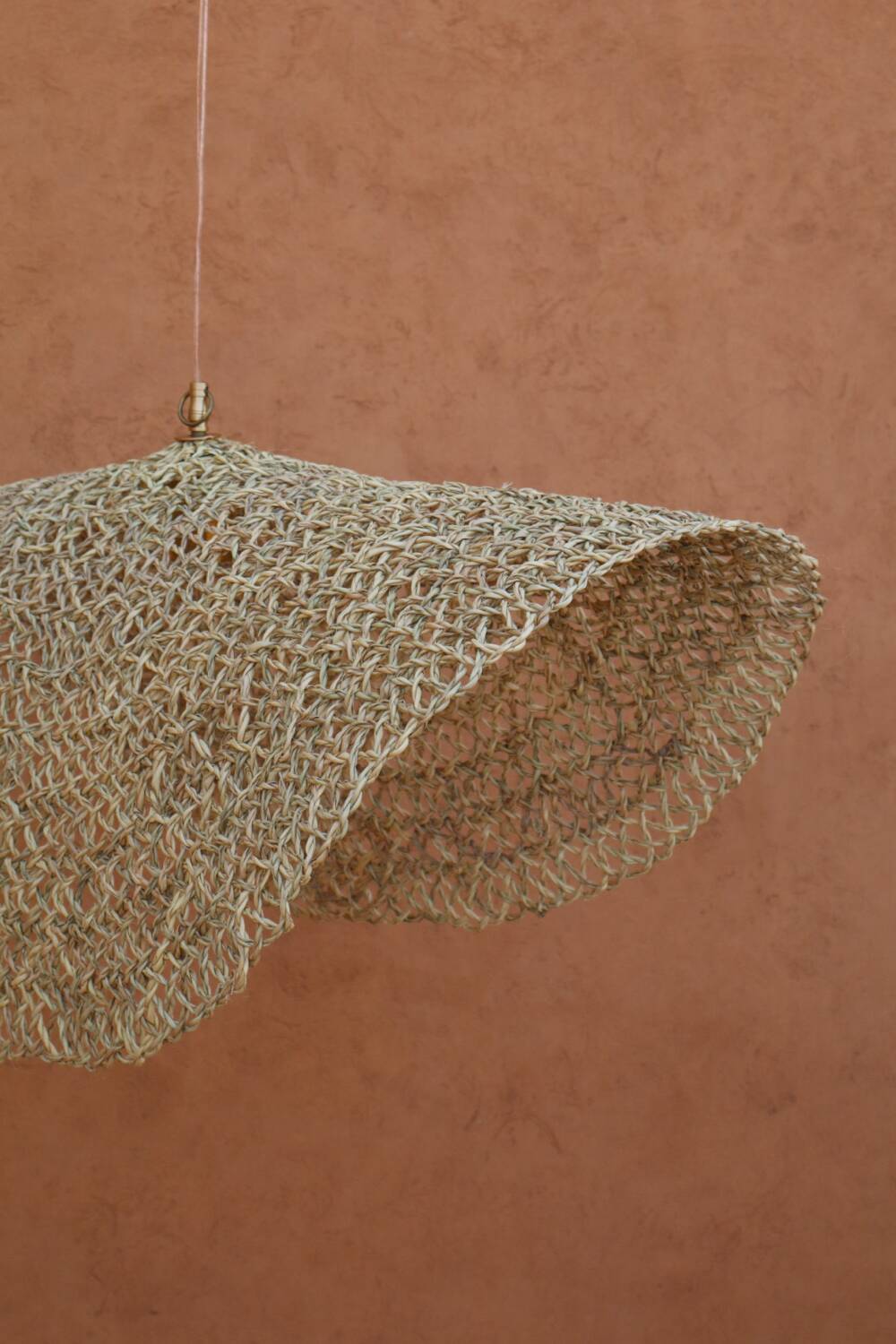 Handmade wicker hanging basket with brass finish