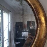 Oval mirror with gold leaf