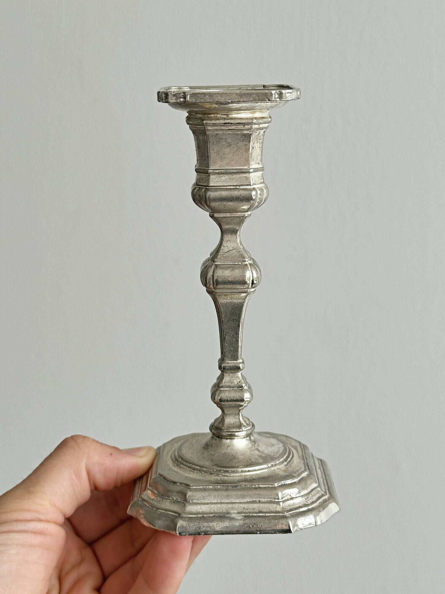 Pair of patinated silver-plated candlesticks