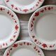 4 vintage porcelain dessert plates with red border and breakfast motif