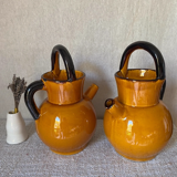 Enameled jugs signed Gomares