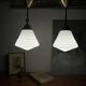 Pair of opaline glass pendant lights in white by Philips and brass from the 1920s.