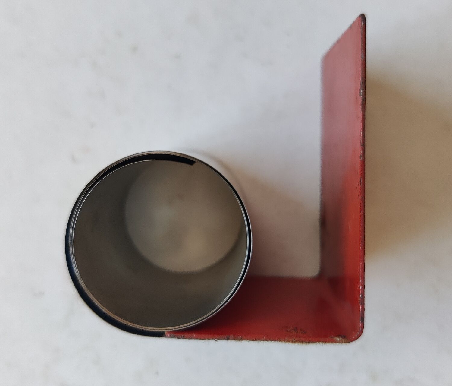 Modernist extendable bookends in brushed stainless steel and red 1970's