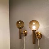 Set of solid brass wall lamps with smoked glass domes