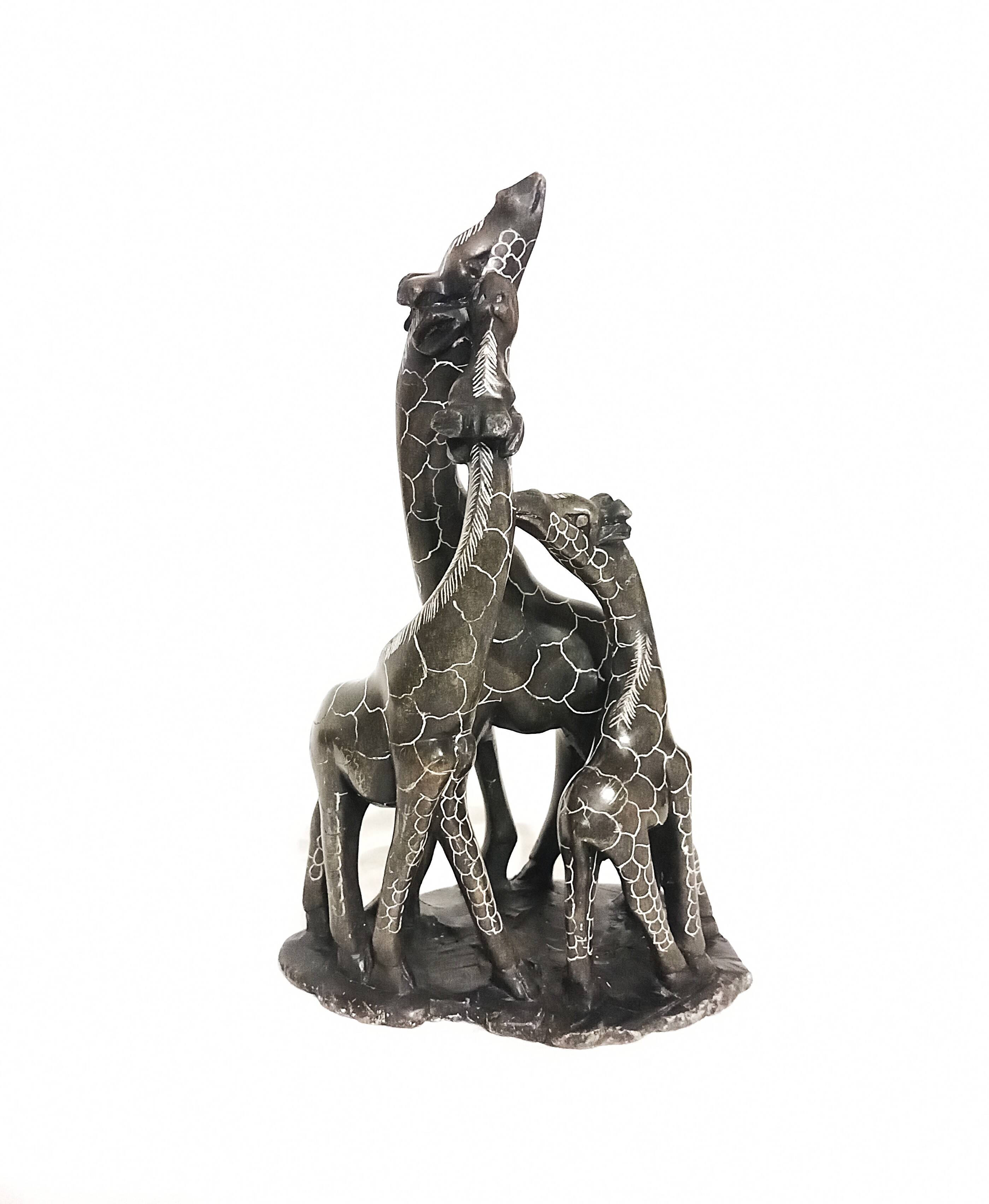 African stone sculpture of 3 Giraffes