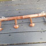 Old wooden coat hook imitating bamboo.