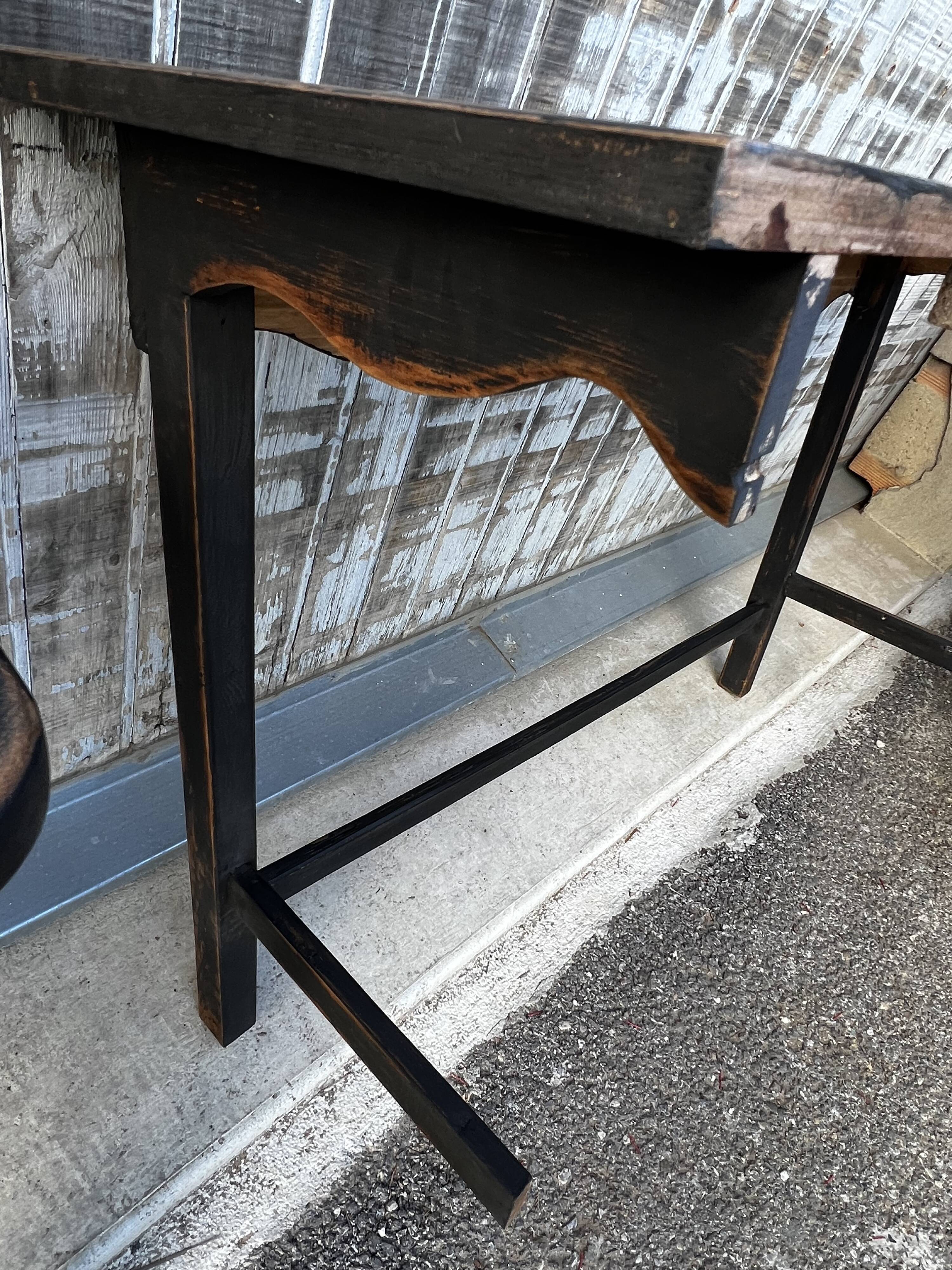 Pair of black patinated consoles