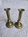 Pair of antique brass candlesticks with adjustable push mechanism from the 19th century.