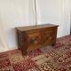 Small antique oak chest with carved panels.