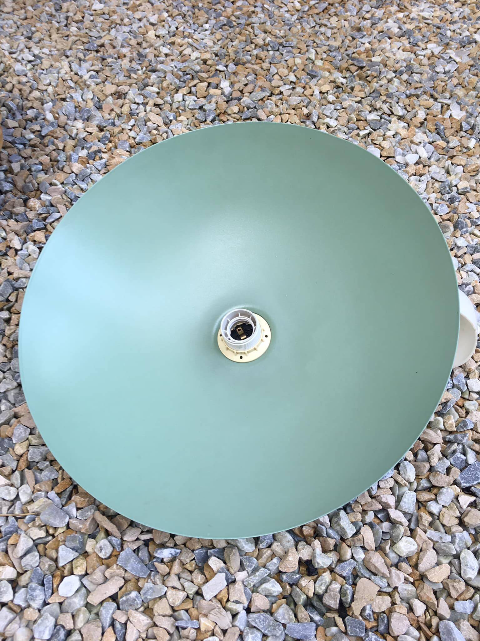Pastel green metal pendant light. White cord.
