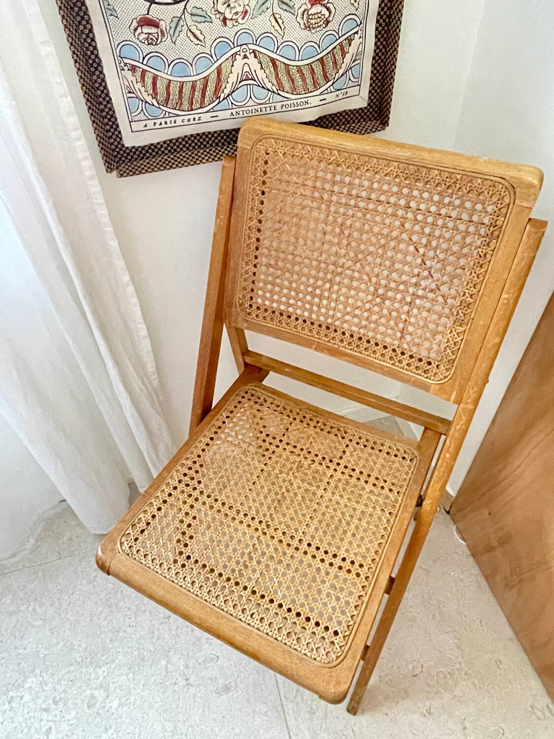 Folding wooden and cane chair
