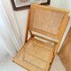Folding wooden and cane chair