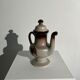 Vintage stoneware teapot with flower and fruit patterns