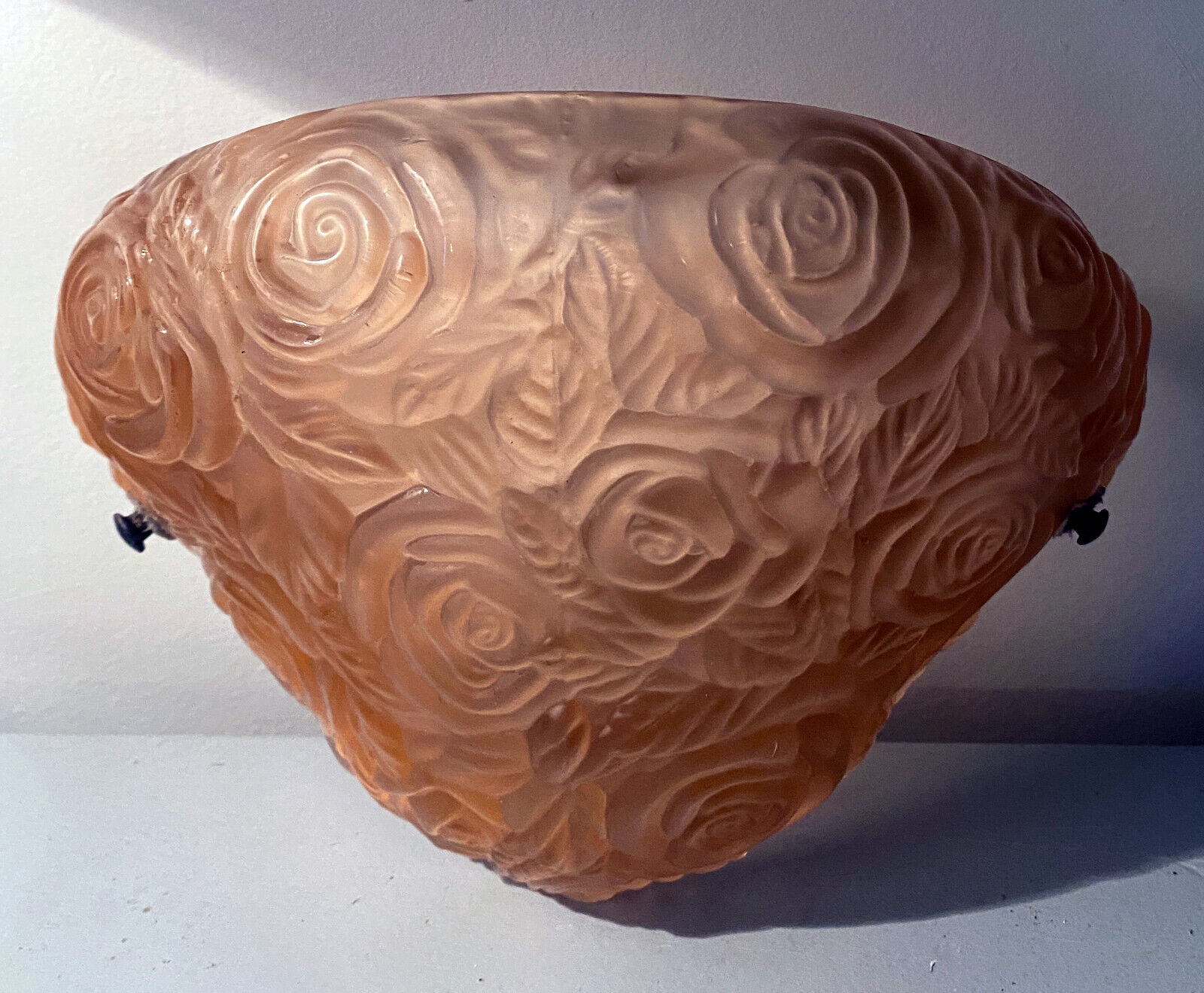 Art Deco wall lamp (1930) with rose patterns in molded pressed glass