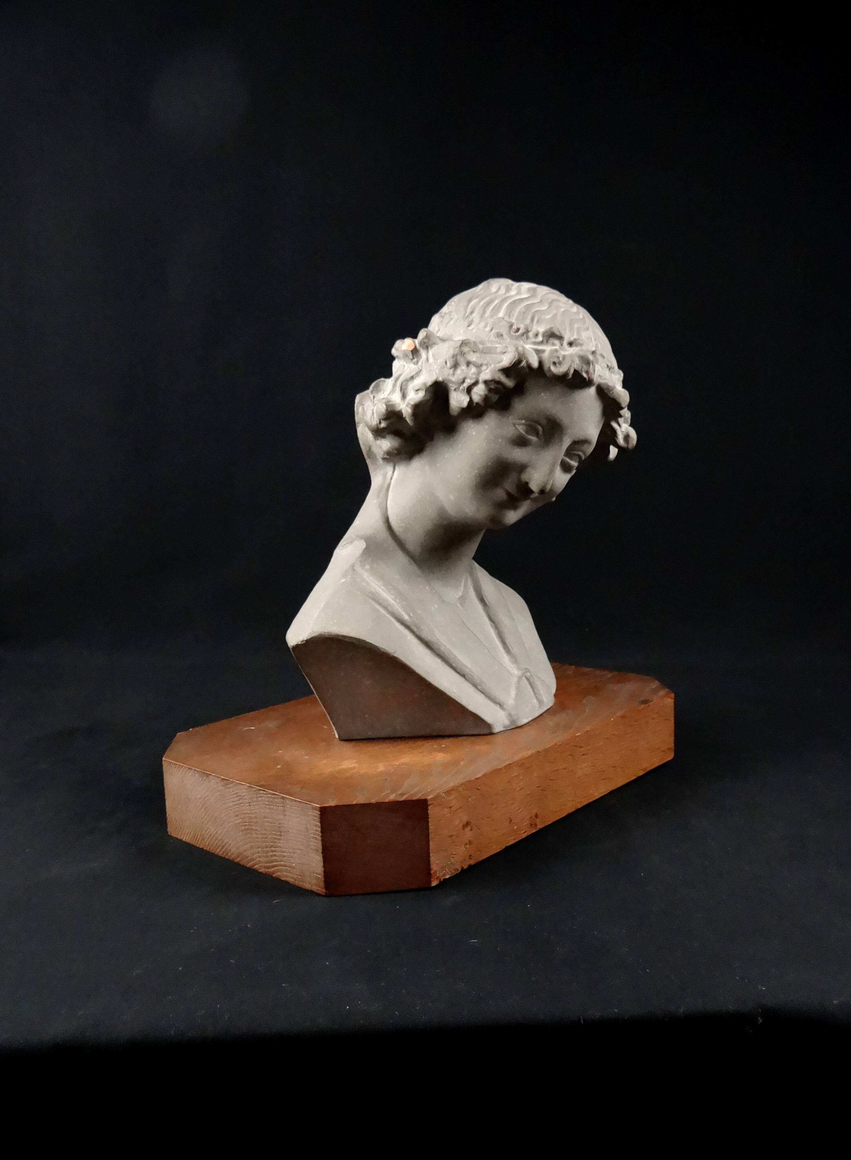 Terracotta bust of the smiling angel from Reims Cathedral with base