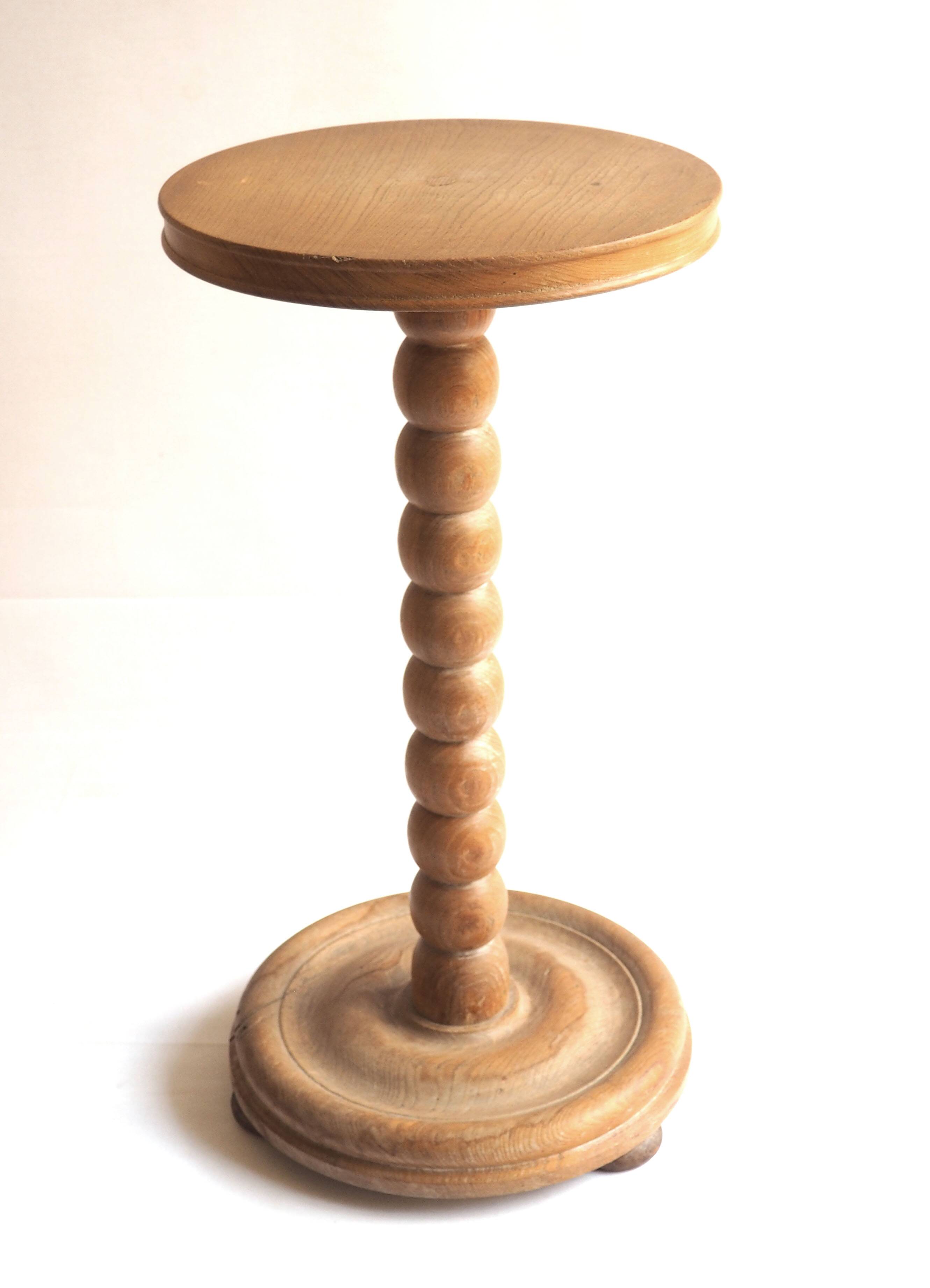 Beaded wood pedestal table