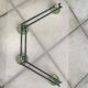 Coat rack with 4 green metal hooks from the 70s