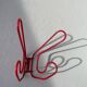 Pair of red metal wall hooks