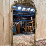 Napoleon III mirror in wood and gilded stucco with gold leaf.