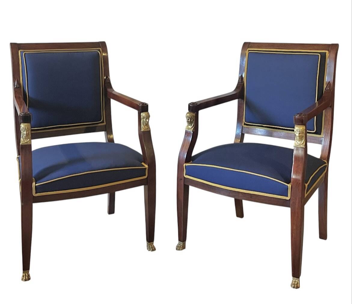 Pair of Empire style armchairs in mahogany and gilt bronze.