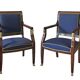 Pair of Empire style armchairs in mahogany and gilt bronze.