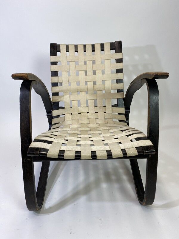 Vintage black lounge chair by Jan Vaněk