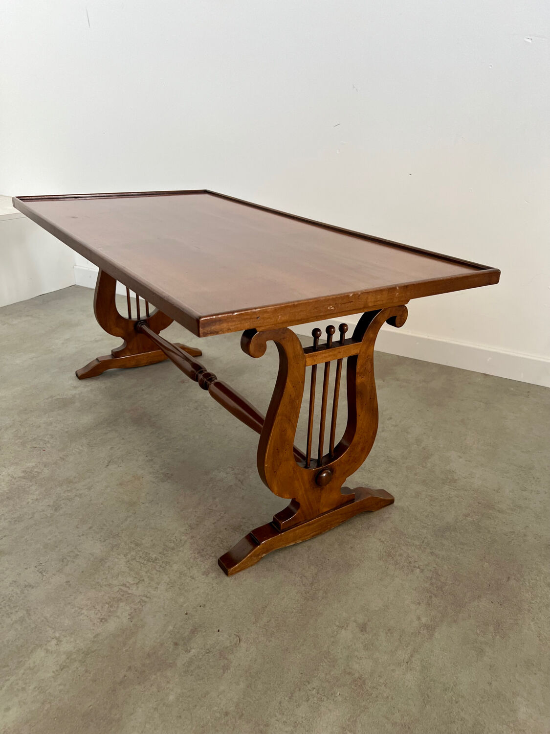 Old rectangular wood coffee table with lyre side posts