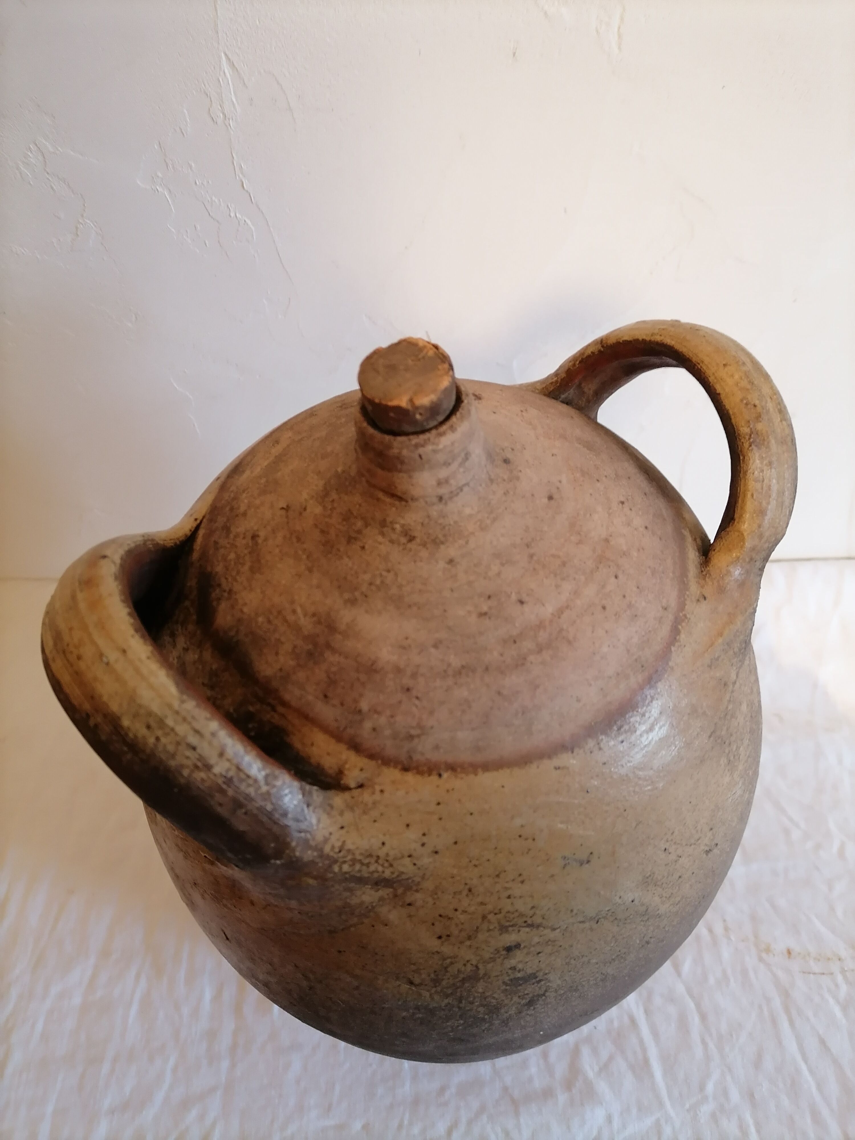 Old jar, glazed sandstone jug. Early twentieth century.