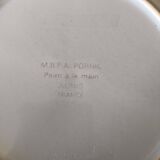 Four flat earthenware plates including 2 Luneville