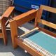 Brutalist-style bench and armchairs in 1970s pine.