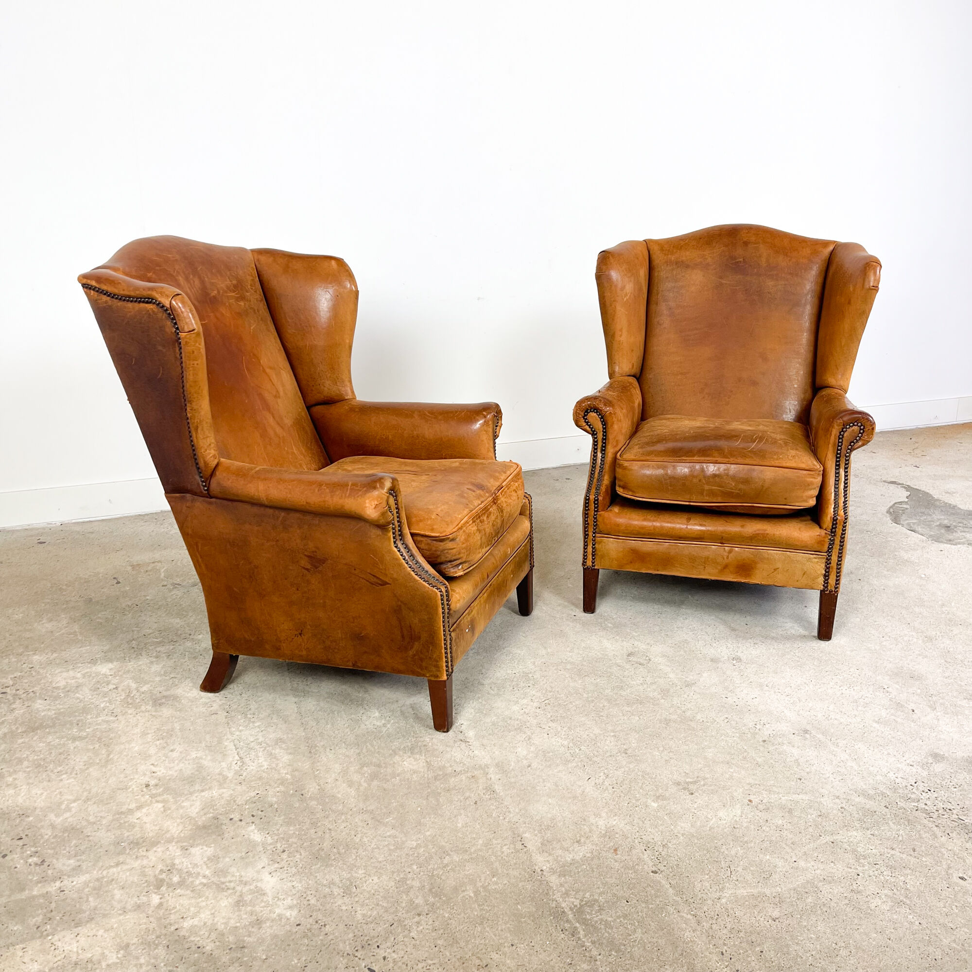 Set of two sheep leather wingback armchairs Delft