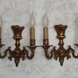 Pair of French baroque brass wall sconces with two branches, decorated with acanthus and wickerwork.